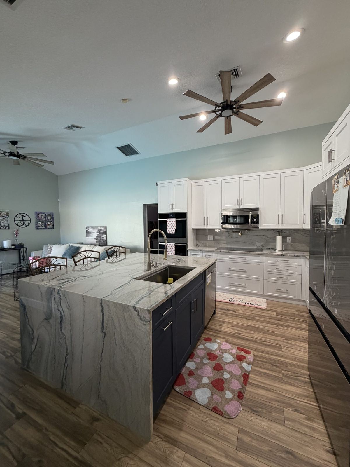 Wellington kitchen with white cabinets and waterfall island